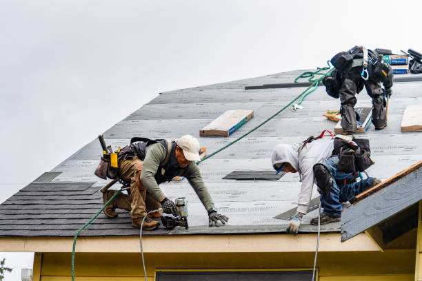 Professional Gutter Installation technician working in Stockbridge, MA